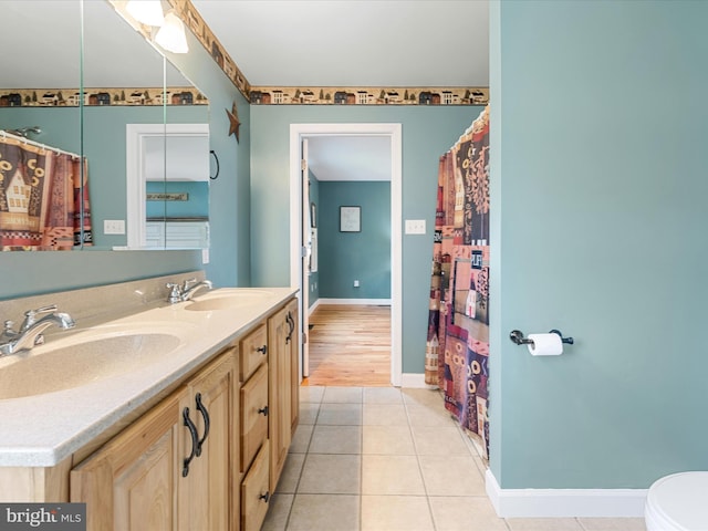 2004 State Road 259 N, Wardensville, WV 26851 - full bath featuring baseboards, a sink, tile patterned floors, and double vanity