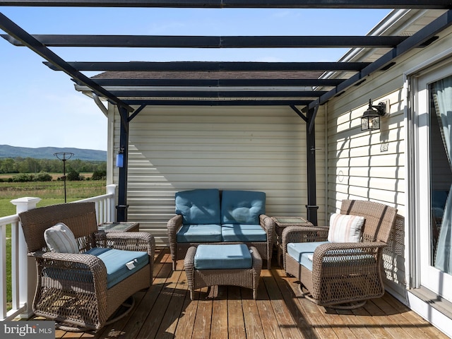 2004 State Road 259 N, Wardensville, WV 26851 - wooden deck featuring a mountain view, a pergola, and an outdoor hangout area