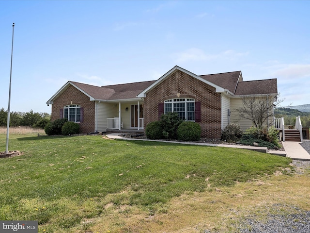 2004 State Road 259 N, Wardensville, WV 26851 - single story home with covered porch, brick siding, a front yard, and roof with shingles