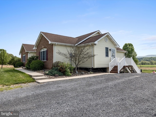 2004 State Road 259 N, Wardensville, WV 26851 - view of side of property with brick siding and a shingled roof
