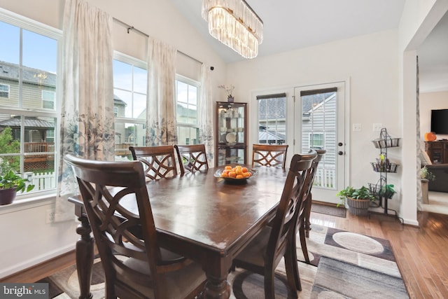 155 Tollerton Trl, Falling Waters, WV 25419 - dining space featuring wood finished floors, a chandelier, and baseboards