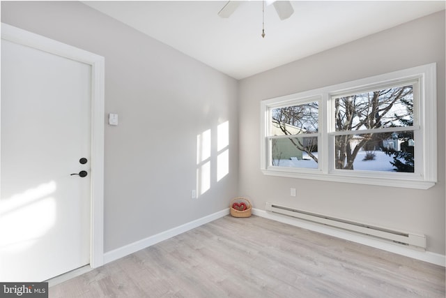 5 Greenmeadow Ln, Whiting, NJ 08759 - empty room with wood finished floors, a healthy amount of sunlight, a ceiling fan, and baseboard heating