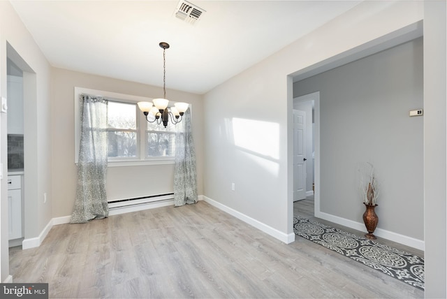 5 Greenmeadow Ln, Whiting, NJ 08759 - unfurnished dining area with baseboard heating, wood finished floors, a chandelier, baseboards, and visible vents