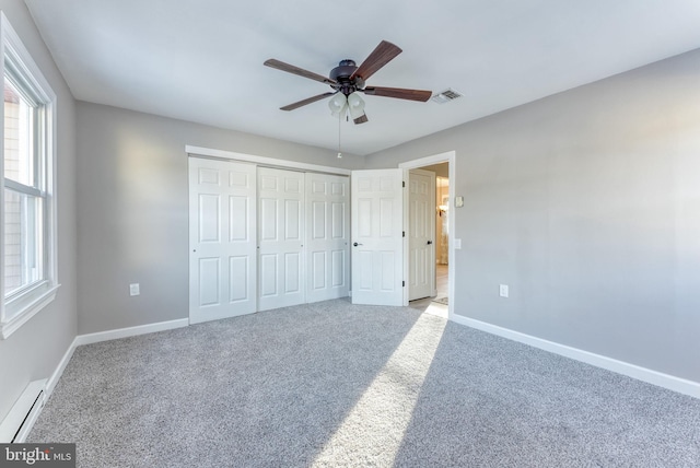 5 Greenmeadow Ln, Whiting, NJ 08759 - unfurnished bedroom with a baseboard heating unit, carpet flooring, baseboards, visible vents, and a closet