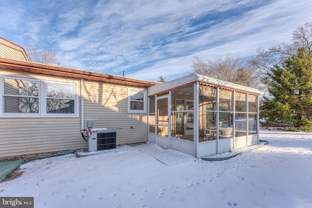 5 Greenmeadow Ln, Whiting, NJ 08759 - snow covered house featuring a sunroom and central AC unit