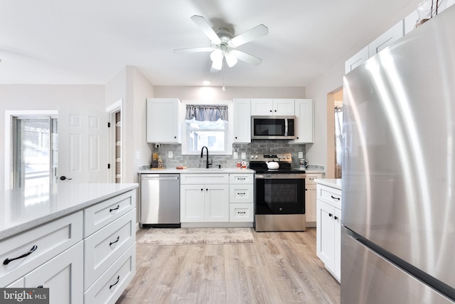 5 Greenmeadow Ln, Whiting, NJ 08759 - kitchen with tasteful backsplash, a sink, light wood-type flooring, ceiling fan, and stainless steel appliances