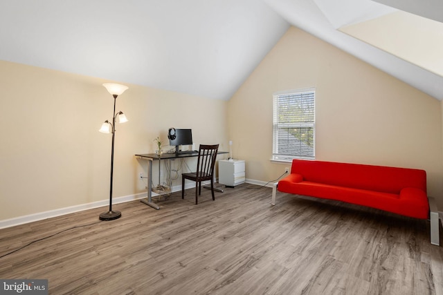 office with vaulted ceiling, wood finished floors, and baseboards