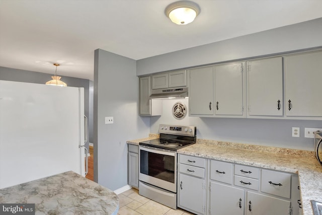 kitchen featuring stainless steel electric range oven, gray cabinetry, light countertops, freestanding refrigerator, and under cabinet range hood