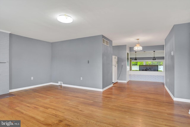 interior space featuring visible vents, baseboards, and light wood-type flooring