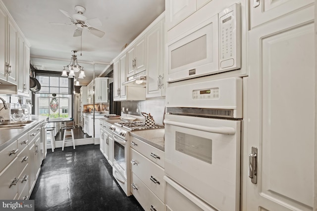 3901 Connecticut Ave NW Unit 402, Washington, DC 20008 - kitchen with a ceiling fan, a sink, white cabinets, white appliances, and light countertops