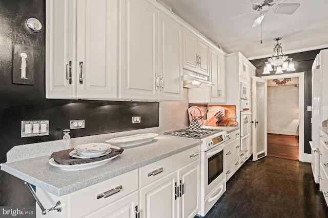 3901 Connecticut Ave NW Unit 402, Washington, DC 20008 - kitchen featuring under cabinet range hood, ceiling fan, white appliances, and white cabinetry