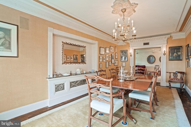 3901 Connecticut Ave NW Unit 402, Washington, DC 20008 - dining space with baseboards, an inviting chandelier, crown molding, and wood finished floors