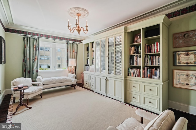 3901 Connecticut Ave NW Unit 402, Washington, DC 20008 - living area featuring crown molding, baseboards, and a notable chandelier