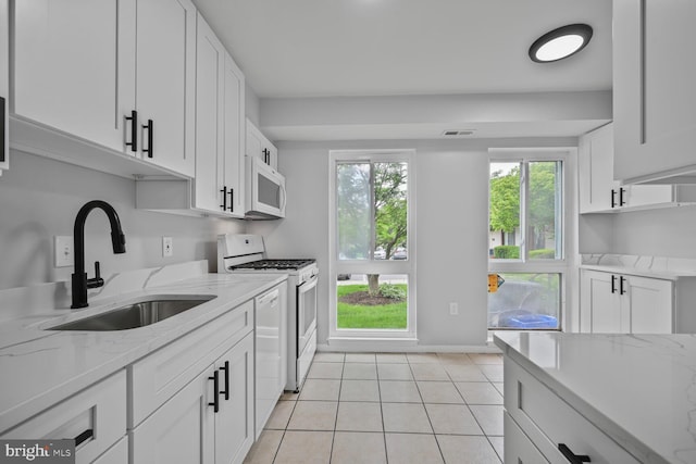 2456 Sun Valley Cir Unit 7-M, Silver Spring, MD 20906 - kitchen with white appliances, a sink, light tile patterned floors, and white cabinets