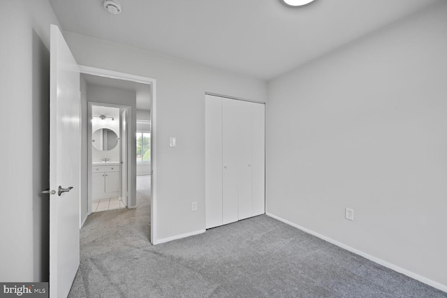 2456 Sun Valley Cir Unit 7-M, Silver Spring, MD 20906 - unfurnished bedroom with baseboards, a closet, and carpet