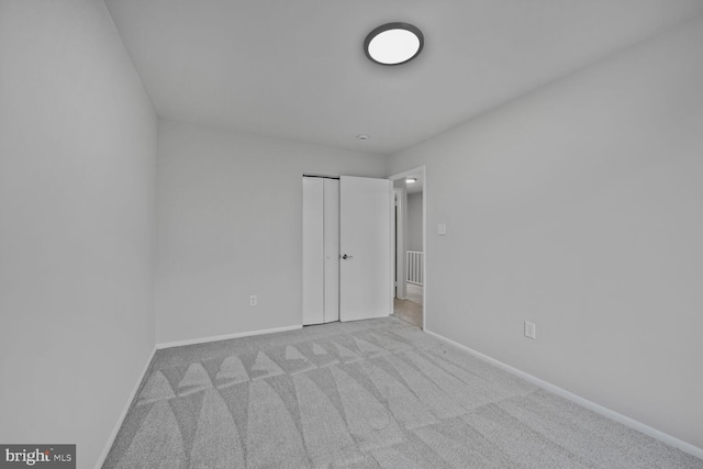 2456 Sun Valley Cir Unit 7-M, Silver Spring, MD 20906 - unfurnished bedroom featuring a closet, baseboards, and carpet floors