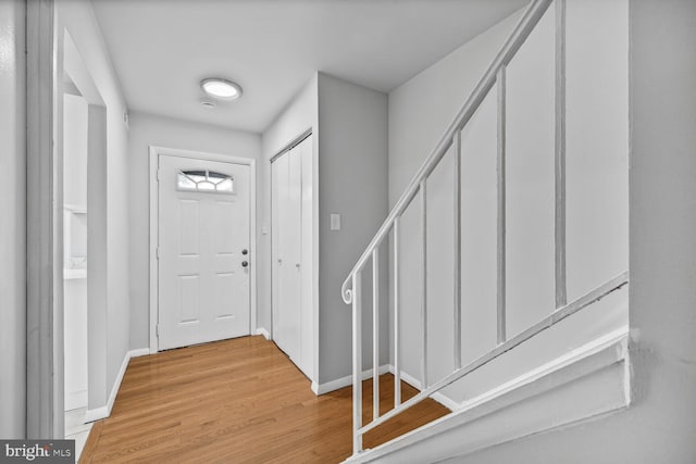 2456 Sun Valley Cir Unit 7-M, Silver Spring, MD 20906 - foyer entrance with baseboards, light wood-style floors, and stairway