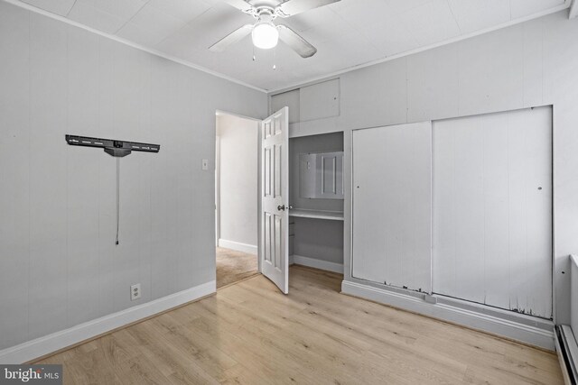 412 Market St, Trenton, NJ 08611 - unfurnished bedroom with baseboards, wood finished floors, ceiling fan, and ornamental molding