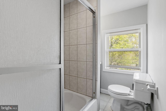 412 Market St, Trenton, NJ 08611 - bathroom with tile patterned floors, toilet, and shower / bath combination with glass door