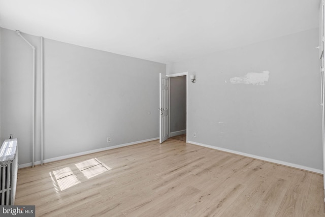 412 Market St, Trenton, NJ 08611 - empty room with light wood-style flooring and baseboards