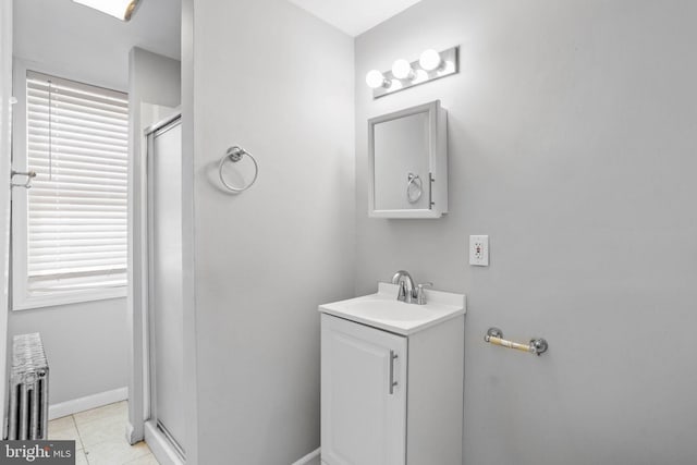 412 Market St, Trenton, NJ 08611 - bathroom featuring a stall shower, tile patterned flooring, vanity, and baseboards