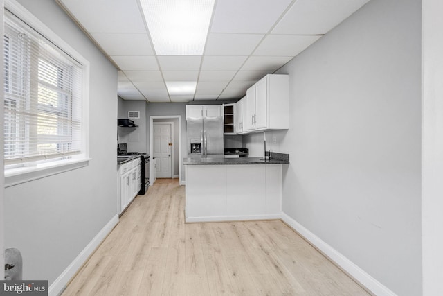 412 Market St, Trenton, NJ 08611 - kitchen with open shelves, stainless steel fridge with ice dispenser, black gas stove, dark countertops, and light wood-type flooring
