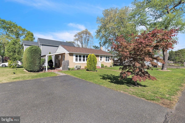 302 Spring Ave, Croydon, PA 19021 - ranch-style home featuring a front lawn, driveway, and a chimney