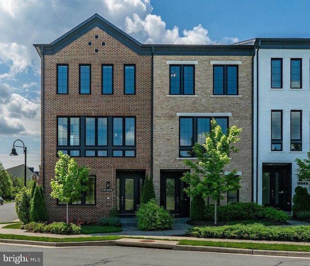multi unit property featuring brick siding