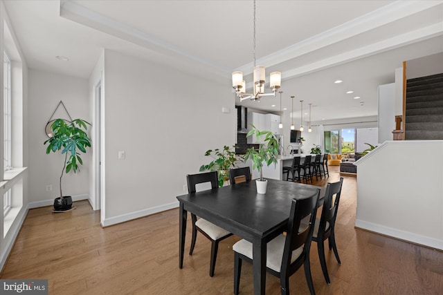 dining area with light wood-style floors, a chandelier, stairs, recessed lighting, and baseboards