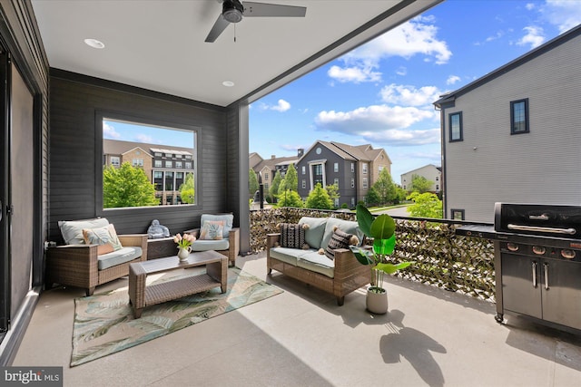 view of patio featuring a ceiling fan, outdoor lounge area, and a residential view