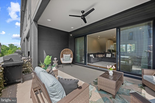 view of patio / terrace with grilling area, an outdoor living space, and a ceiling fan