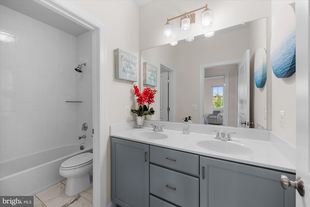 bathroom with double vanity, toilet, shower / tub combination, and marble finish flooring