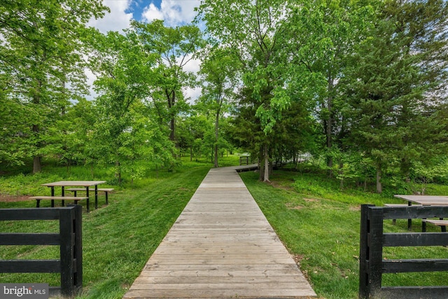 view of home's community featuring a lawn