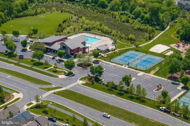 bird's eye view of a forest and a pool