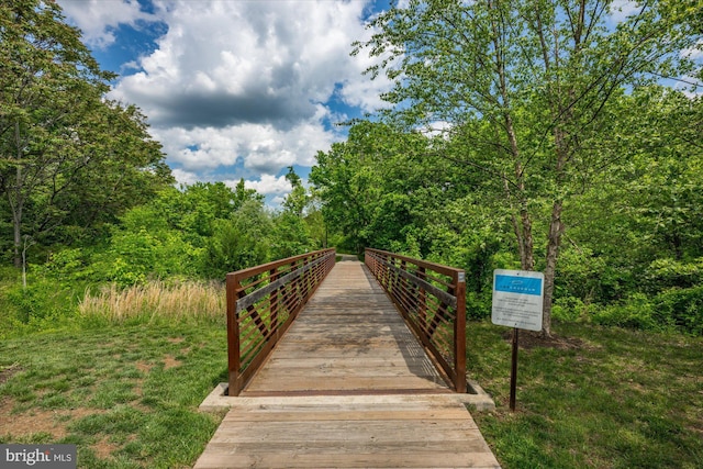 surrounding community featuring a forest view