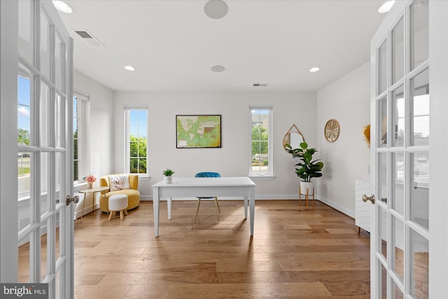office space with french doors, light wood-style flooring, recessed lighting, and baseboards