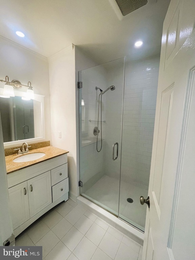 bathroom with tile patterned floors, a stall shower, vanity, visible vents, and recessed lighting