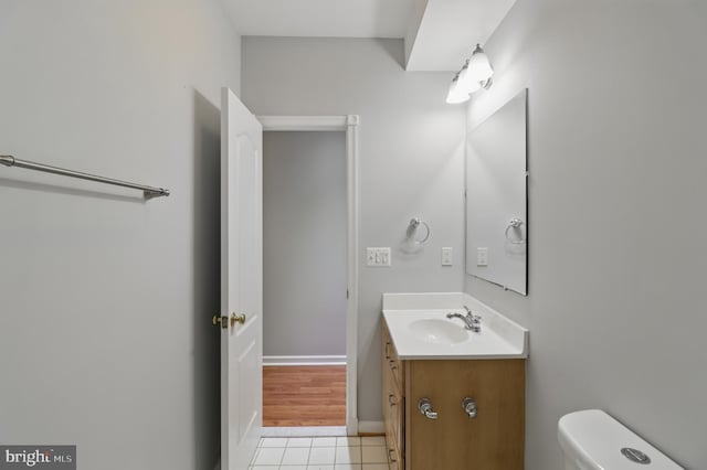 42827 Freedom St, Chantilly, VA 20152 - bathroom featuring vanity, toilet, tile patterned floors, and baseboards