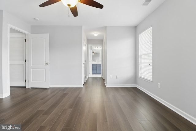 42827 Freedom St, Chantilly, VA 20152 - unfurnished bedroom with dark wood-style floors, baseboards, ensuite bathroom, and a ceiling fan