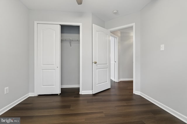 42827 Freedom St, Chantilly, VA 20152 - unfurnished bedroom featuring dark wood-type flooring, baseboards, and a closet
