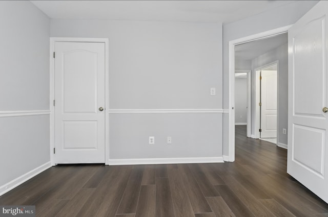 42827 Freedom St, Chantilly, VA 20152 - unfurnished bedroom featuring dark wood-style flooring and baseboards