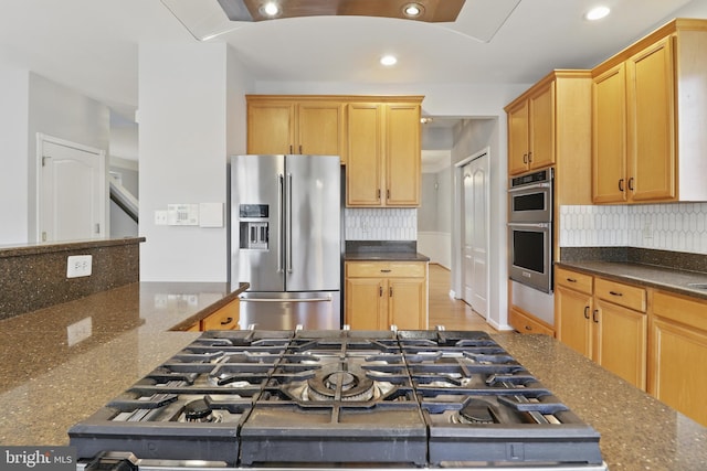 42827 Freedom St, Chantilly, VA 20152 - kitchen with stainless steel appliances, recessed lighting, decorative backsplash, and dark stone counters