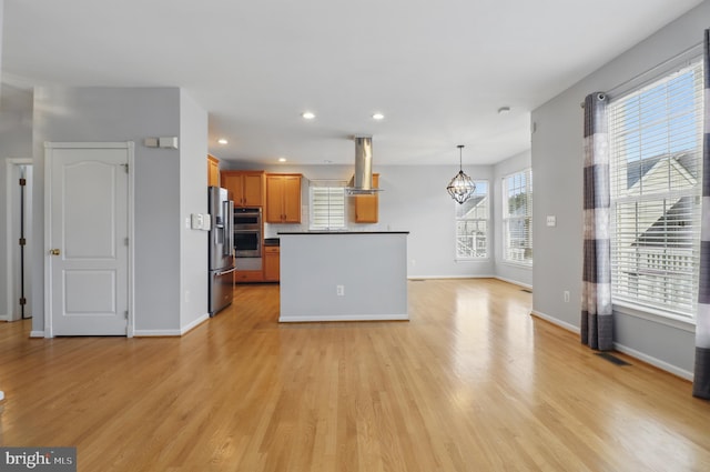 42827 Freedom St, Chantilly, VA 20152 - kitchen featuring island exhaust hood, appliances with stainless steel finishes, light wood-type flooring, a chandelier, and recessed lighting