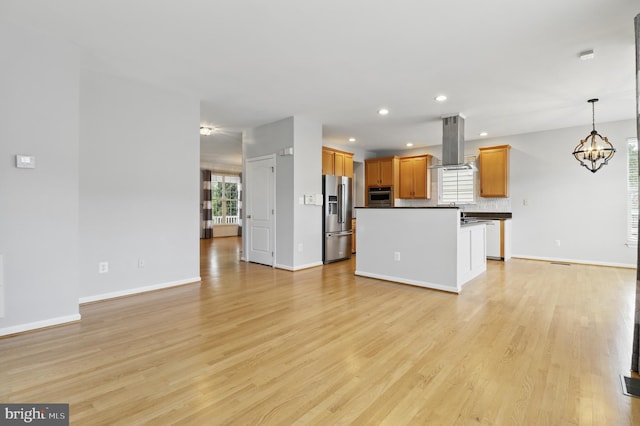 42827 Freedom St, Chantilly, VA 20152 - unfurnished living room featuring light wood-style flooring, baseboards, a chandelier, and recessed lighting