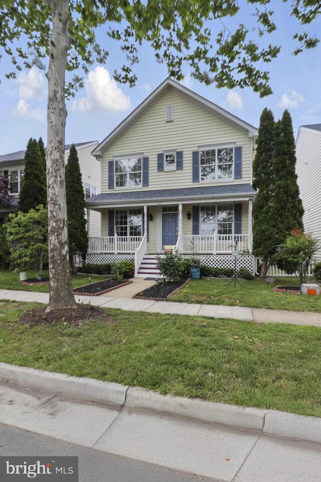 42827 Freedom St, Chantilly, VA 20152 - traditional-style house with covered porch and a front yard