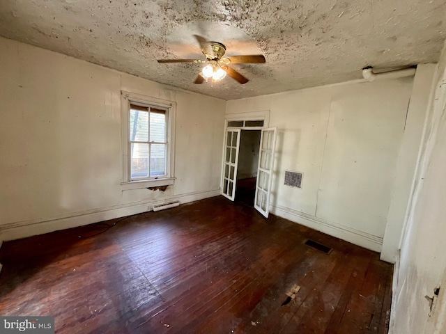 407 Carruthers St, Lexington, VA 24450 - unfurnished bedroom with hardwood / wood-style floors, a textured ceiling, a baseboard heating unit, baseboards, and visible vents