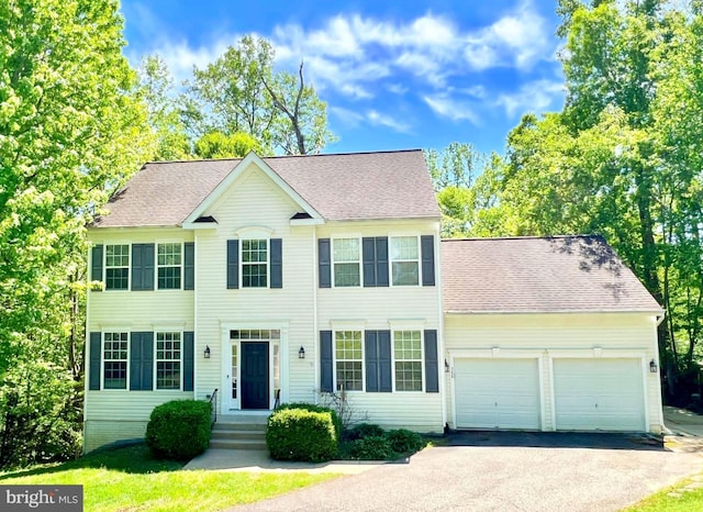 388 Wood Landing Rd, Fredericksburg, VA 22405 - colonial inspired home featuring a garage, driveway, and a shingled roof