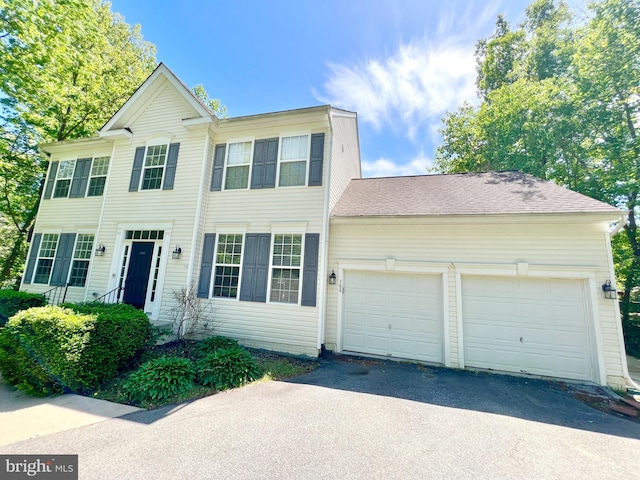 388 Wood Landing Rd, Fredericksburg, VA 22405 - colonial home with a garage, roof with shingles, and driveway