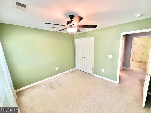 388 Wood Landing Rd, Fredericksburg, VA 22405 - unfurnished bedroom featuring a closet, light colored carpet, and visible vents