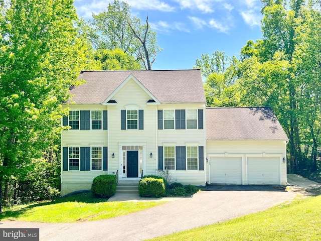 388 Wood Landing Rd, Fredericksburg, VA 22405 - colonial house with an attached garage, a shingled roof, a front lawn, and driveway